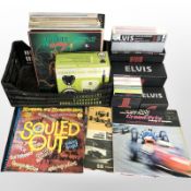 A group of vinyl LP records including Bob Dylan, Status Quo,