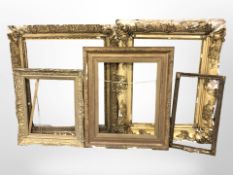 Five 19th century gilt wood and gesso picture frames in distressed condition,