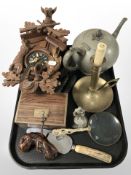 A reproduction carved cuckoo clock, chamber stick, horn handled cake slice, corkscrew,