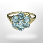 A 9ct gold blue zircon cluster ring, size U1/2 CONDITION REPORT: 2.