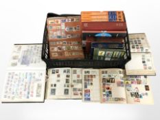 Several albums of world stamps, Stanley Gibbons catalogues,