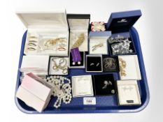 A group of costume jewellery, brooches, faux pearls,