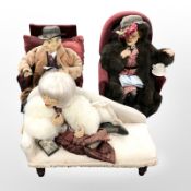 Three vintage dolls, seated on armchairs and a chaise longue, largest 43 cm wide.