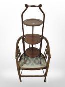 A late Victorian inlaid mahogany armchair and a three tier cake stand.