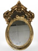 A gilt plaster Venetian style mirror,