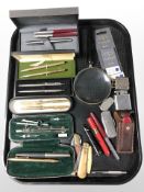 Boxed pens including Parker, Cross and several pockets knives, lighters, Swiss Army knife,