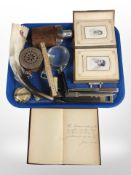 An embossed leather photograph album containing monochrome photographs, journal,