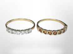 Two 9ct gold dress rings, one CZ, the other set with orange stones, each size U.