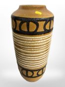 A West German glazed earthenware vase, height 44 cm.