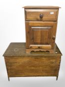 A contemporary pine blanket box, width 91 cm, and a bedside cupboard.