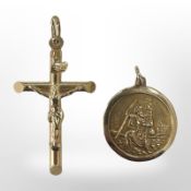 A 9ct gold crucifix pendant and a St Christopher, longest 35mm. CONDITION REPORT: 4.