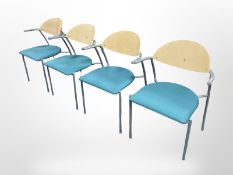 A set of four contemporary laminated office chairs.