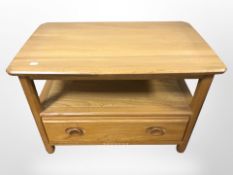 An Ercol elm low drop leaf entertainment stand,
