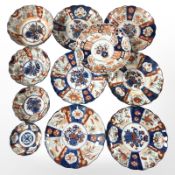 Eleven various 19th century Japanese export Imari plates and bowls,