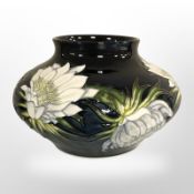 A modern Moorcroft 'Queen of the Night' squat vase, dated 2001, height 10.5 cm, with original box.