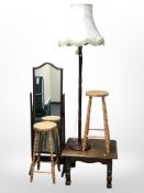 An oak coffee table, pair of pine stools, standard lamp,