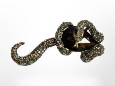 A snake with prey synthetic gemstone brooch