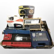 A group of tools and hardware including dremel attatchment set, digital precision caliper,