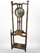 An Edwardian oak mirror back hall stand,