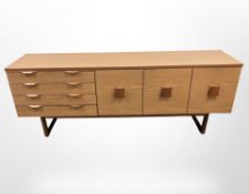 A 20th century teak veneered sideboard,