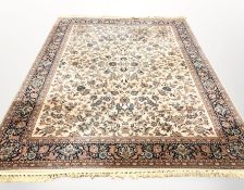 A machine made carpet of North-West Iranian Tabriz design, 384 cm x 276 cm.