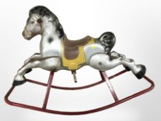 A vintage child's tin rocking horse,