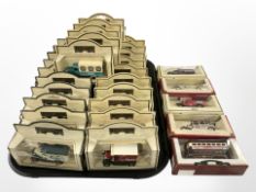 A collection of Days Gone die cast buses and delivery vans, in boxes.