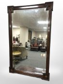 An Edwardian mahogany bevelled mirror, width 84 cm.