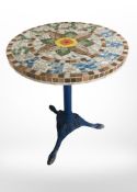 A mosaic circular table on painted cast iron support, marked Barney Silvia to top, height 72 cm.