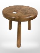 A burr elm tripod stool by Errol Hut Woodwork, height 28 cm.
