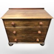 An early 20th century pine three drawer chest,