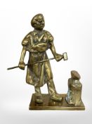 A cast brass figure of a Blacksmith, height 18.