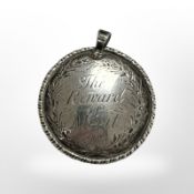 An early 19th century Reward of Merit medal, dated 1804.