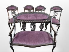 A reproduction three seater salon settee in purple upholstery,