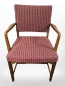 An oak framed armchair and a bamboo glass topped table