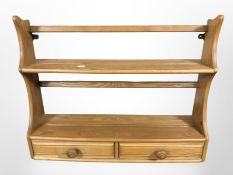 An Ercol elm two drawer plate rack, width 70 cm.