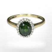 A 9ct gold emerald and diamond cluster ring, size U1/2 CONDITION REPORT: 2.