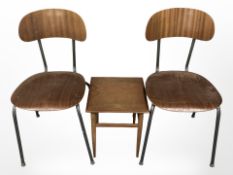 A pair of 20th century laminated wood chairs and a small teak occasional table.