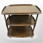 An Ercol stained elm three tier trolley,