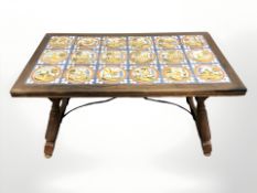 An early 20th century oak tile inset coffee table, 100 cm x 55 cm x 56 cm.