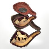 Two 19th century Meerschaum pipes, both surmounted by horses, in original boxes.