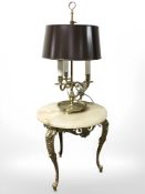 A brass and onyx occasional table and a brass lamp.
