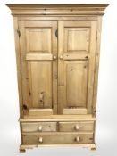 A modern pine double door wardrobe,