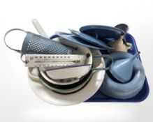 A group of early 20th century continental enameled kitchen items, including funnels, pan lids,