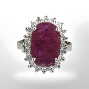 An 18ct white gold ruby and diamond cluster ring,