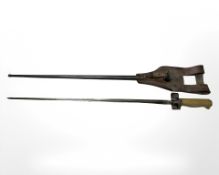 A French M 1886 / 93 / 16 Lebel Epee bayonet with brass hilt, steel scabbard and leather frog,