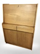 A 20th century teak fall front bureau, 76 cm x 40 cm x 106 cm.