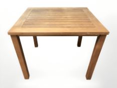 A Mandaly teak table, 90 cm x 75 cm x 72 cm.