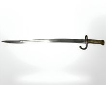 A French M 1866 Chassepot sabre bayonet, with brass hilt, blade 57 cm.