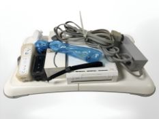 A Nintendo Wii, Wii fit board, controllers,